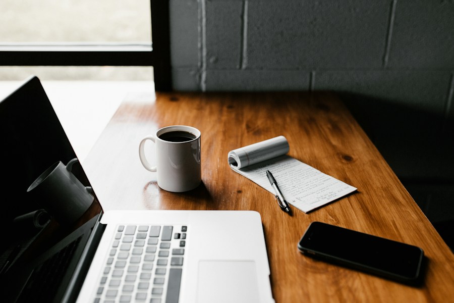 Illustrative photograph of a person working on a laptop